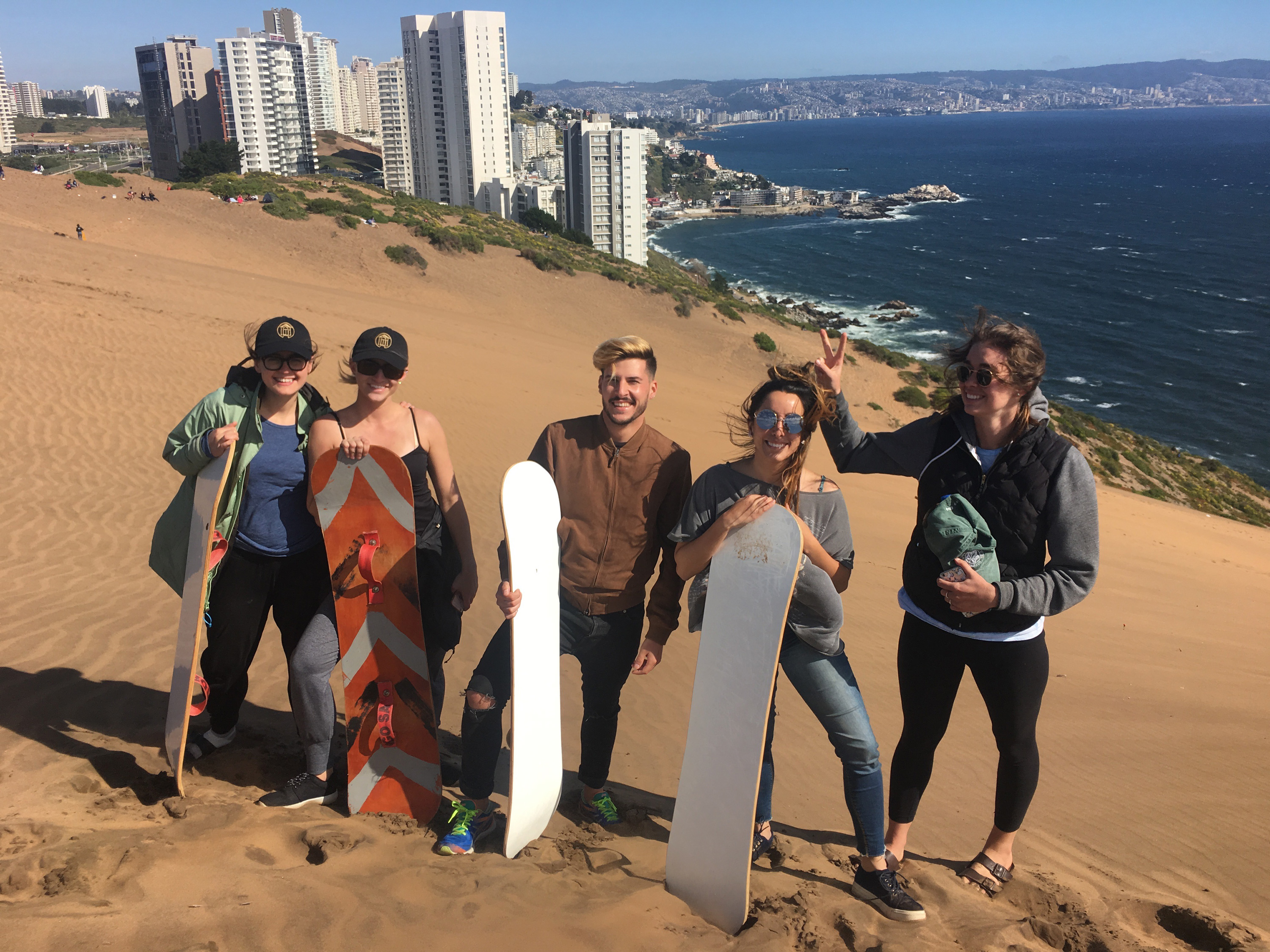Fellows exploring the sand dunes around Viña del Mar, with mentor Constanza and California office colleague, Patrick.