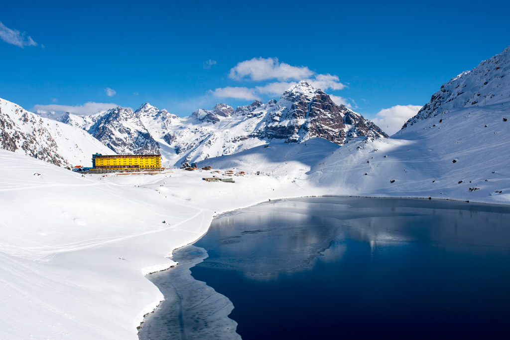 Hotel Portillo stands out against the dramatic Andes and Laguna del Inca. Photo courtesy of Ski Portillo.