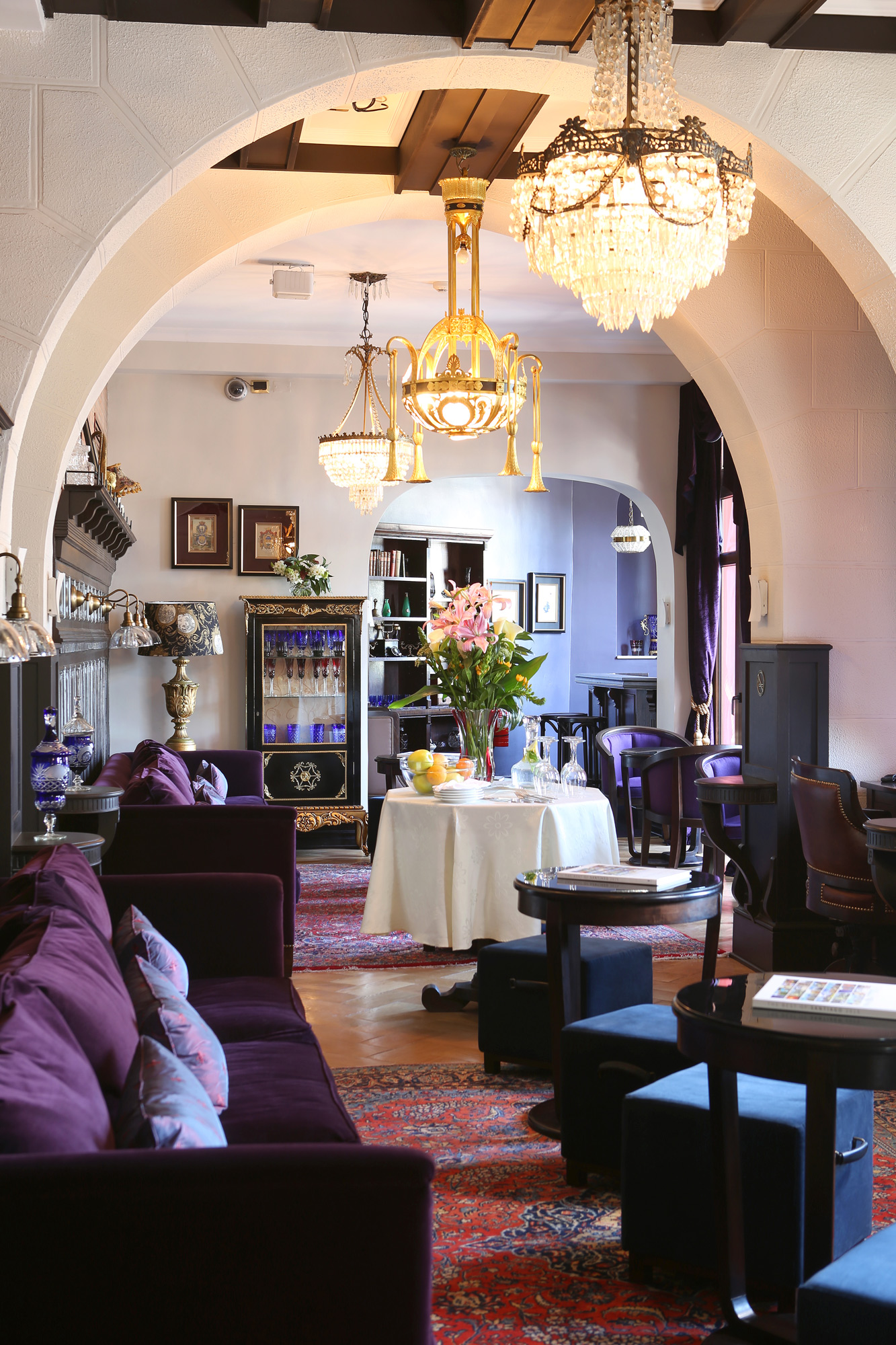 Velvet pillows and antique chandeliers are just part of the appeal at the Castillo Rojo lounge.