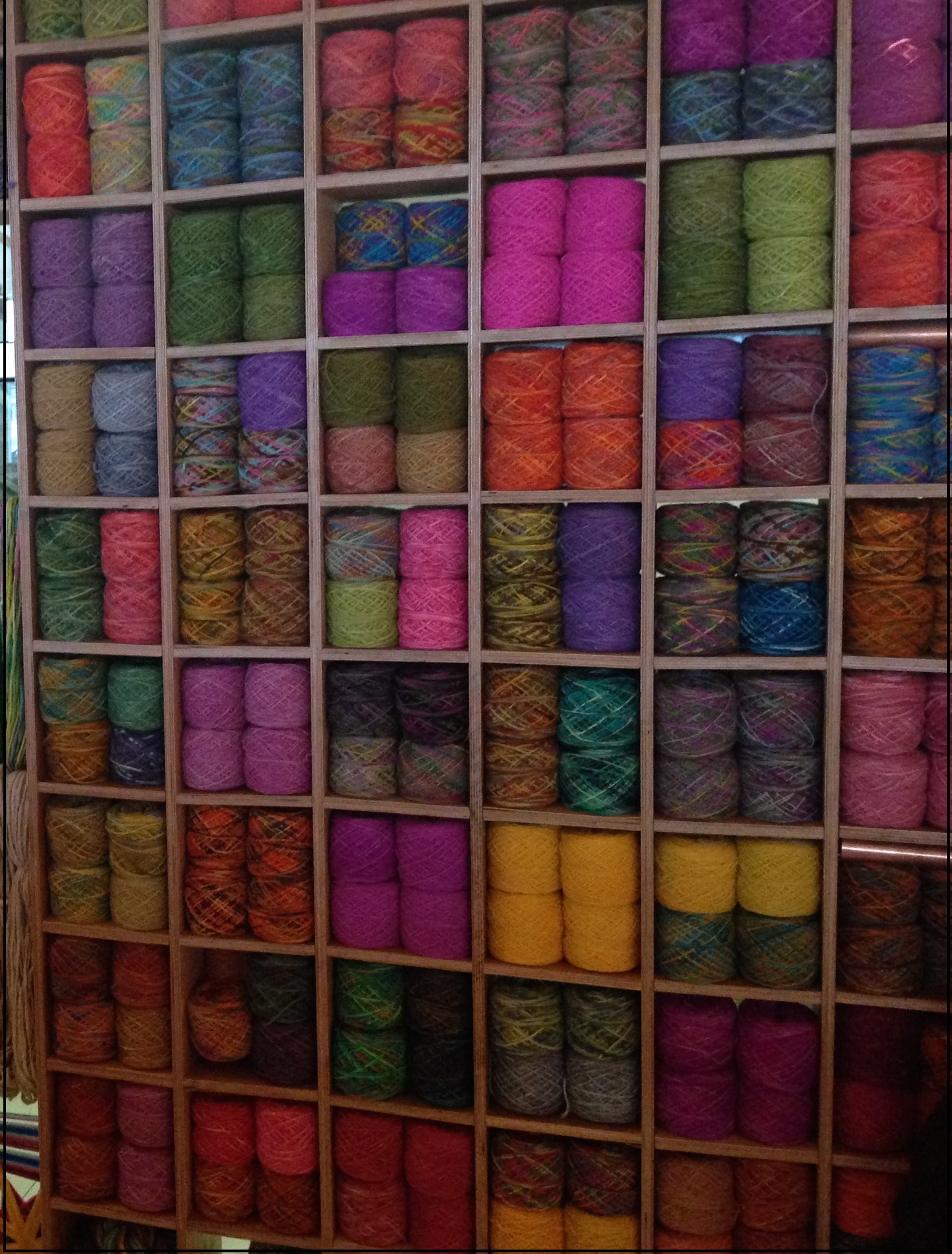 A wool stall at the Puerto Montt airport presents many colorful choices.